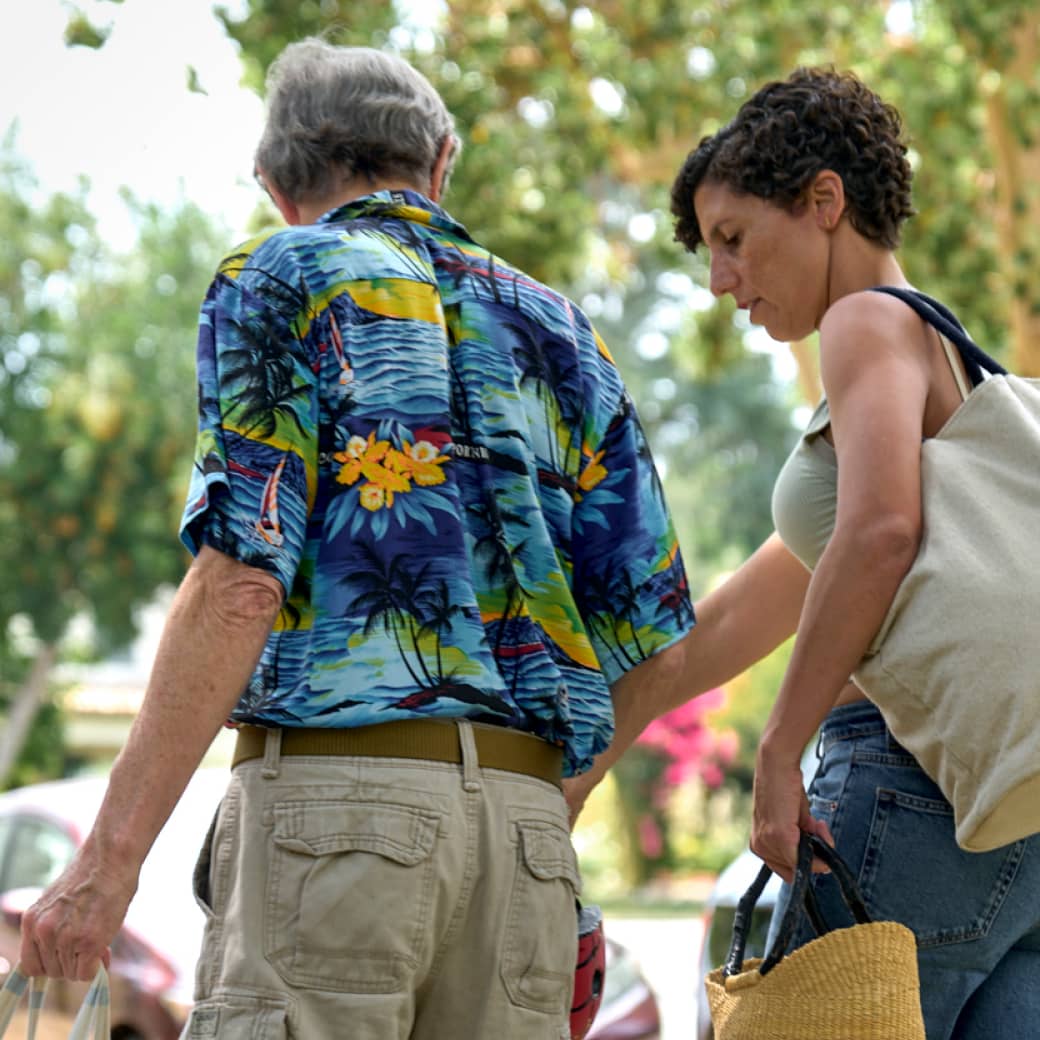 A couple on their way to an outdoor event.