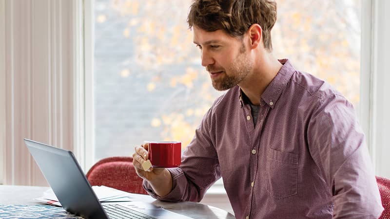 A person looking at their laptop screen.
