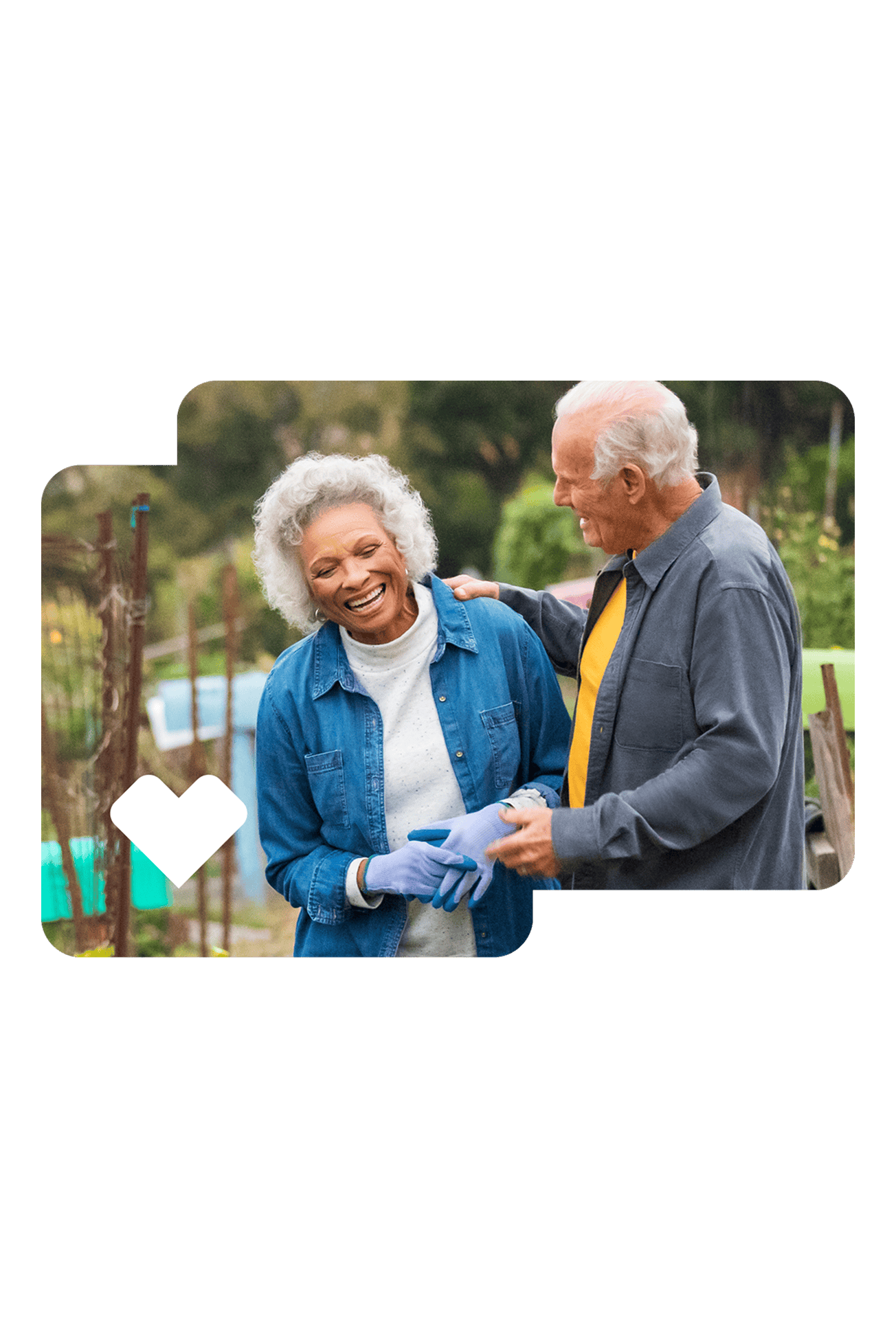 An older adult couple working in a garden.