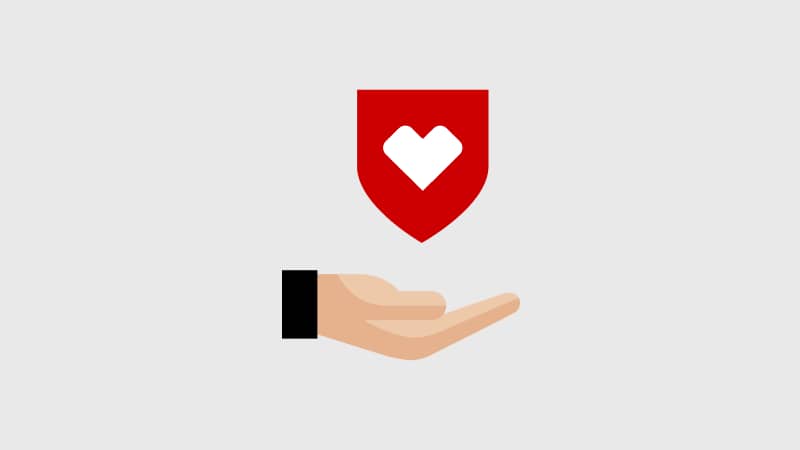 Pictogram of a shield with a CVS heart above an open hand