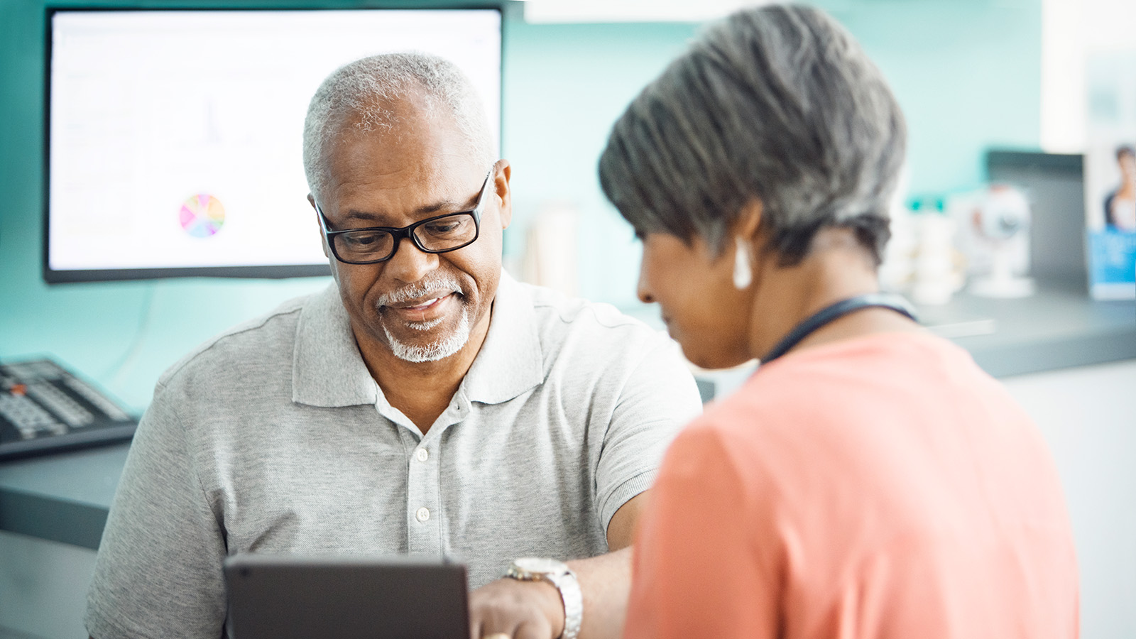 A patient discussing with a healthcare professional in an office